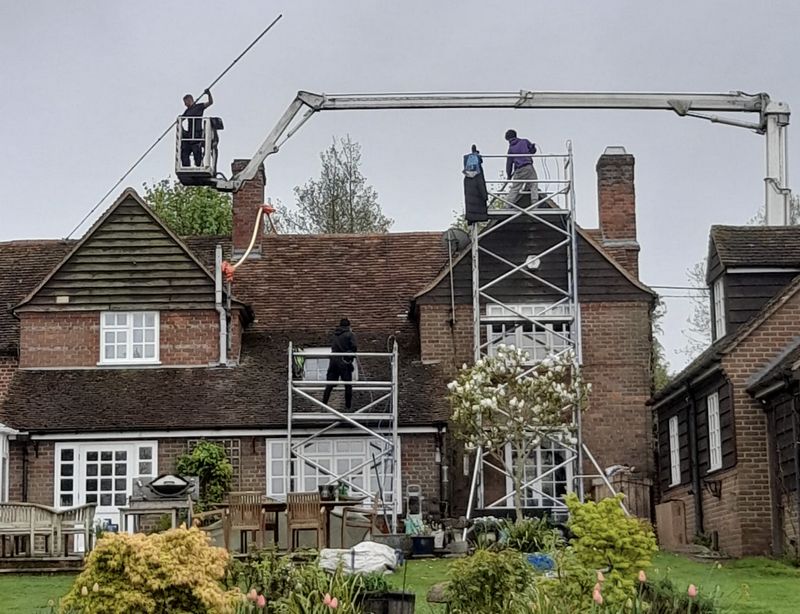 The Roof Moss Cleaners using cherry picker and scaffolding to clean roof safely and professionally in Barton-le-Clay, Bedfordshire