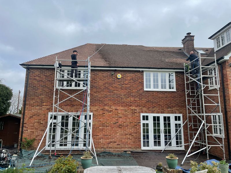 Roof cleaning carried out safely from scaffold towers by The Roof Moss Cleaners in Barton-le-Clay